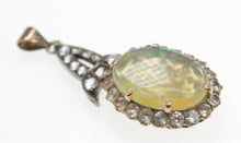 Load image into Gallery viewer, An early 20th century unmarked gold cabochon fire opal and white sapphire pendant
